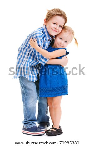 Loving brother and little sister hugging isolated over white