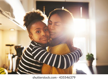 Loving Child Hugging Mother Looking At Camera Looking Calm