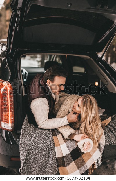 Loving couple in a car in the winter forest, NOISE
EFFECT ON PHOTOS