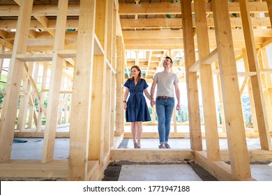 Loving Couple At Construction Site Of Their New Home Dreams Come True