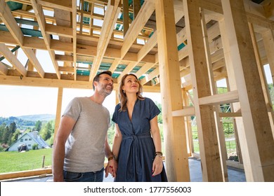 Loving Couple At Construction Site Of Their New Home Dreams Come True