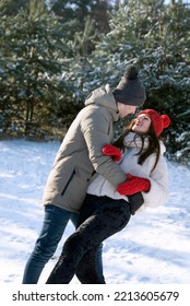 Loving Couple Dancing In Winter Forest. Walk On Frosty Clear Day.