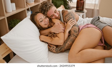 Loving couple embracing on a bed in a cozy bedroom setting, reflecting intimacy and comfort. - Powered by Shutterstock