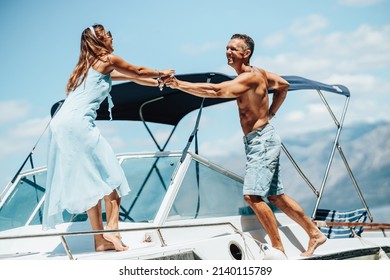 A Loving Couple Enjoying A Relaxing Day On Private Yacht.