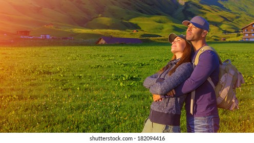 Loving couple enjoying sunset in the mountains, Alps, Austrian mountain, summer adventure, active family, romantic travel in Europe 