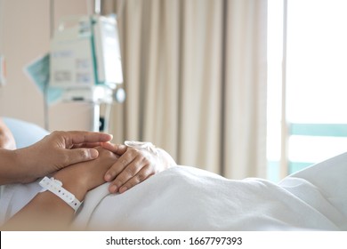 Loving couple holding hands, Hopeful, care love emotional concept, Together women hold hand lover while Sick Patients with Infusion pump infuses fluid. Encouragement comforting Recovering from family - Shutterstock ID 1667797393