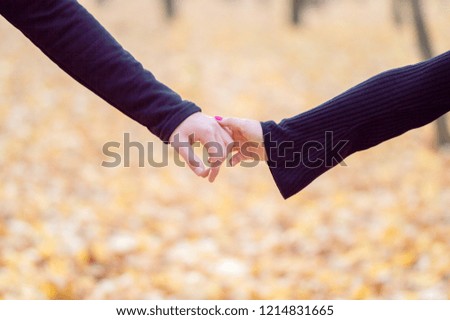
loving couple holding hands as a sign of love, trust and support