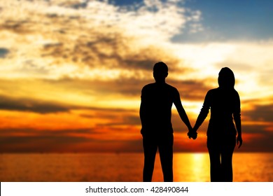 Loving Couple Holding Hands Sunset Stock Photo (Edit Now) 428490844