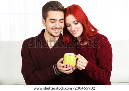 Loving couple with hot drink