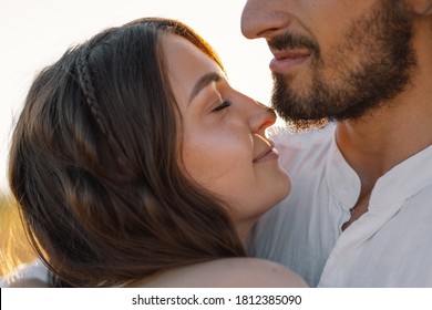 A loving couple hug in nature. Being happy together. Happy Summer - Shutterstock ID 1812385090
