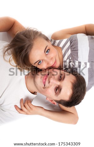 Man looking to beautiful woman lying on bed