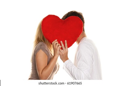 Loving Couple Kissing Behind A Heart. Love Is Beautiful. Secret Love