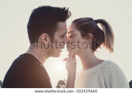 Loving couple kissing outdoor at sunset - Concept about people, love and lifestyle Сток-фото © 