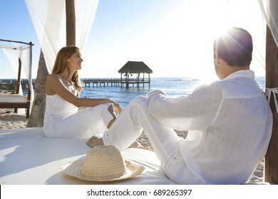 Loving Couple Laughing On A Beach Bed