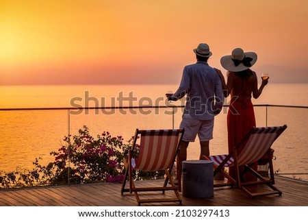Similar – Image, Stock Photo Couple enjoys a sunset picnic on the rooftop
