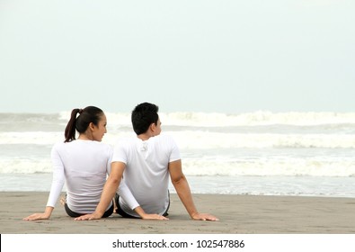 Loving Couple Relaxing And Spending Quality Time With Each Other On Beach