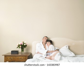 Loving Couple Sleeping Together In Bed