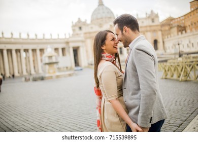 Loving couple at the St. Peter's Square in Vatican, Italy