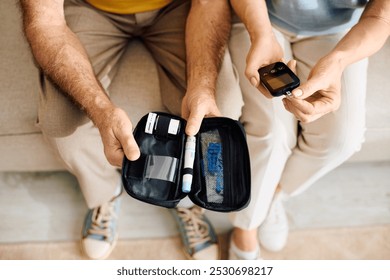 A loving couple supports each other at home while managing diabetes with care and compassion. - Powered by Shutterstock