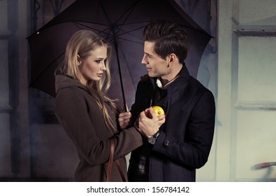 Loving Couple Under Umbrella