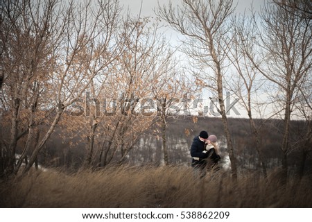 Similar – Image, Stock Photo Couple kissing on the field