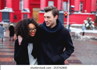 Loving Couple In A Winter Day In The City,African Girl  And Caucasian Man