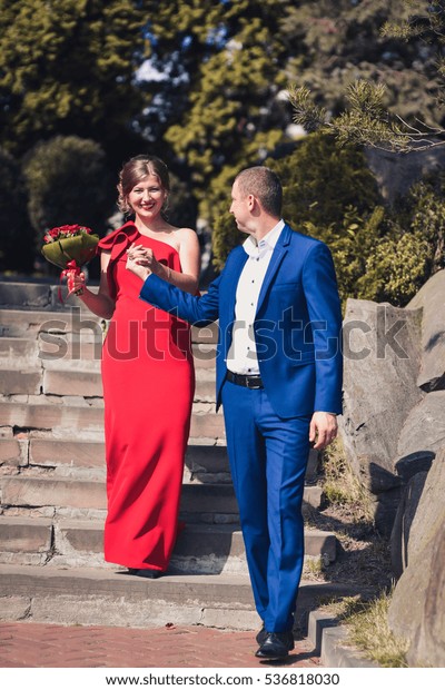 blue suit red dress