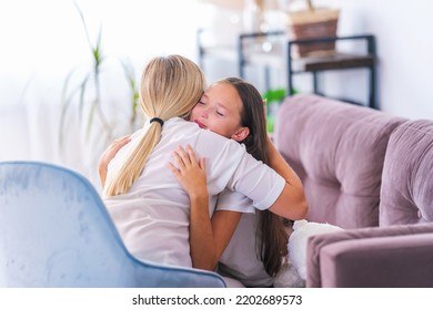 Loving Daughter Embraces Her Mother, A Mother Enjoys A Moment Of Tenderness With Her Eyes Closed, Feels Deep Love For Her Beloved Child, Family Maternal Support, Adoption Of A Child.