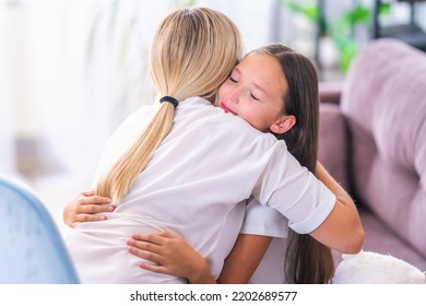 Loving Daughter Embraces Her Mother, A Mother Enjoys A Moment Of Tenderness With Her Eyes Closed, Feels Deep Love For Her Beloved Child, Family Maternal Support, Adoption Of A Child.