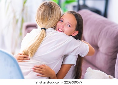 Loving Daughter Embraces Her Mother, A Mother Enjoys A Moment Of Tenderness With Her Eyes Closed, Feels Deep Love For Her Beloved Child, Family Maternal Support, Adoption Of A Child.