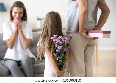 Loving Daughter And Grandmother Preparing Surprise For Mother, Standing With Box And Flowers In Hands Behind Back, Congratulating With Birthday Or Mothers Day, Happy Family Party, Multi Generational