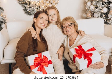 A loving family scene with three generations enjoying Christmas, exchanging gifts, and sharing joy in a festive setting. Perfect for holiday-themed concepts and family togetherness. - Powered by Shutterstock