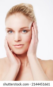 Loving Her Radiant Skin. Portrait Of A Beautiful Blonde Woman Looking At The Camera.