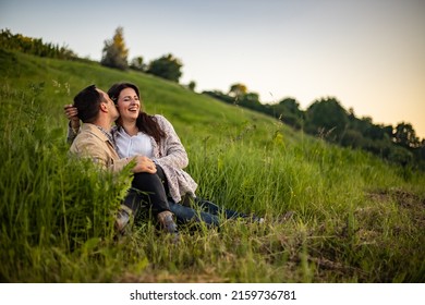 Loving hipster couple walking in the field, kissing and holding hands, hugging, lying in the grass in the summer at sunset. valentines day. - Shutterstock ID 2159736781