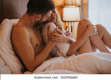 Loving And Hugged Couple On The Bed In The Room