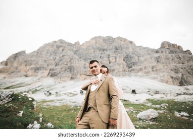 Loving husband and woman on the background of the mountains. Loving couple emotionally spends time - Shutterstock ID 2269293439