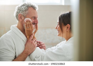 Loving Joyful Married Couple In Plush Robe Having Fun In Room Indoors