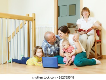 loving married couple with children and  grandmother in home interior together - Powered by Shutterstock