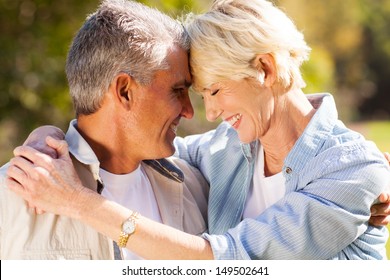 Loving Middle Aged Couple Hugging With Eyes Closed Closeup Portrait