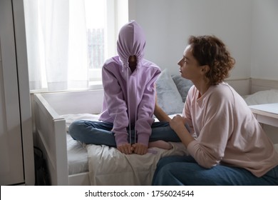 Loving Mother Comfort Talk With Depressed Introvert Teen Daughter Hiding In Hood Suffering From School Problems, Caring Mom Make Peace Reconcile With Stubborn Teenage Child, Puberty Trouble Concept