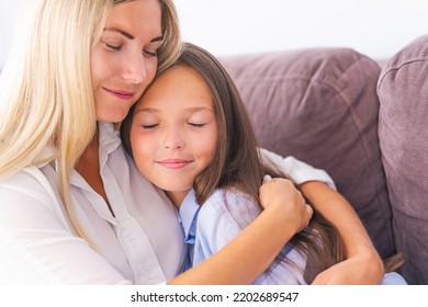 Loving Mother Embraces Her Daughter, A Mother Enjoys A Moment Of Tenderness With Her Eyes Closed, Feels Deep Love For Her Sweet Child, Family Maternal Support, Adoption Of A Child.