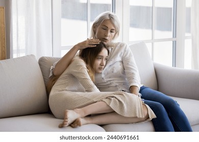 Loving mum stroking her frustrated pre-teen daughter, give emotional support, feeling empathy, give advice, having good trustful relationship between teenager and parent. Adolescence problems, care - Powered by Shutterstock