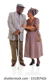 loving senior african couple looking one another over white background