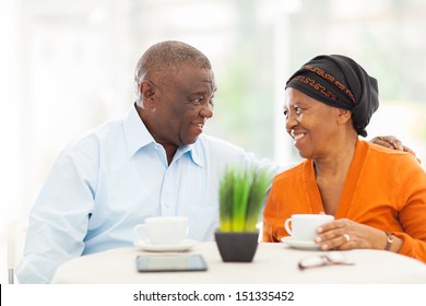 Loving Senior African Couple Relaxing At Home