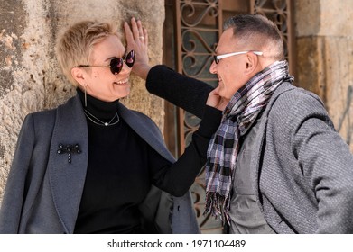 Loving Senior Couple Hugging. Outdoor Senior Couple Enjoying Tender Moment