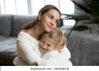 Loving Single Mother Hugging Cute Little Daughter Showing Love Care Support, Happy Woman Embracing Preschool Girl At Home, Mum And Kid Sincere Warm Relationships, New Mom For Adopted Child Concept