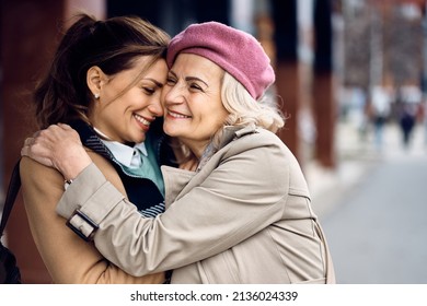 Loving woman and her senior mother embracing while spending time together in the city.  - Powered by Shutterstock