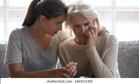 Loving worried grown up daughter soothe comforts middle aged mother supporting her in difficult time showing love attention and care, helping with problem, express empathy news about disease concept