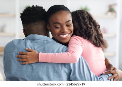 Loving Young Black Mother Soldier In Camouflage Uniform Bonding With Her Daughter And Husband, African American Woman Back Home From Military Service, Celebrating Reunion With Her Family, Copy Space