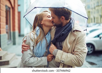 Loving Young Couple In Love Under Umbrella In The Rain